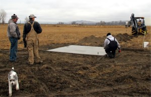 Overseeing the new pivot pad and electrical-water line trench