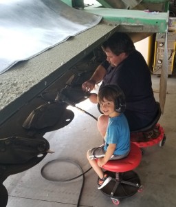 Hunter helping Uncle Micah change discbine teeth